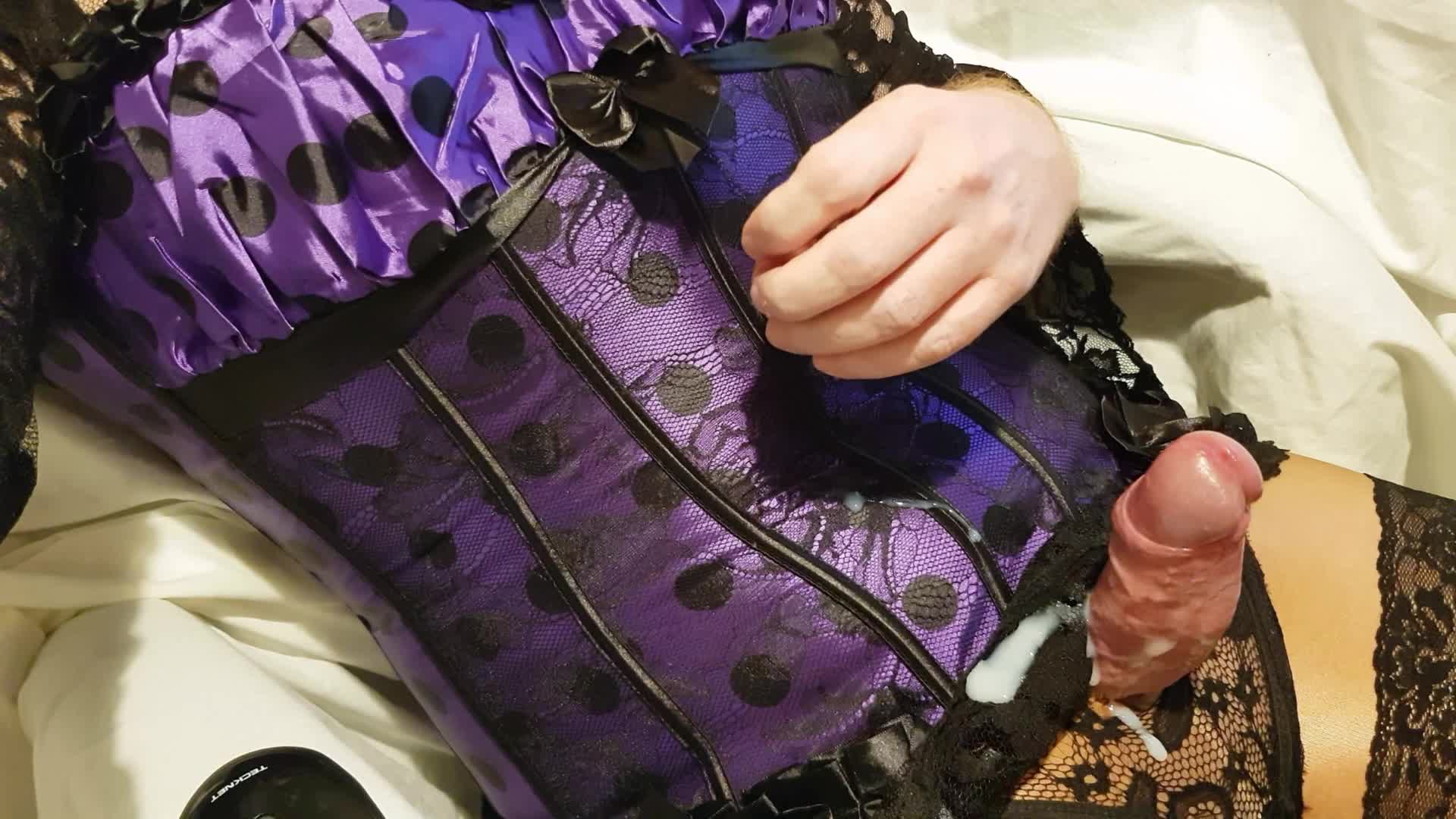 Crossdresser wanks and cums in purple corset